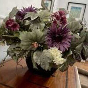 Faux flower arrangement in pot